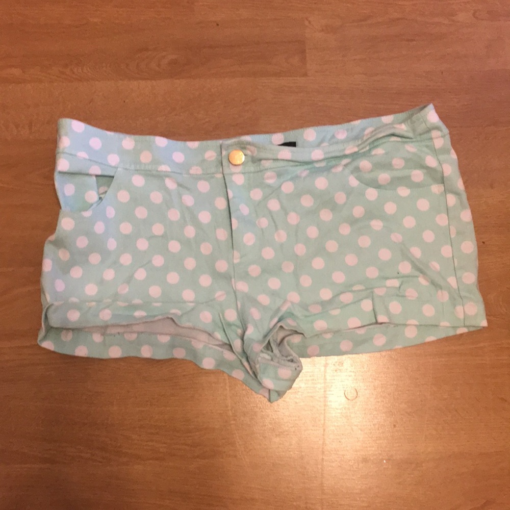 Pastel blue shorts with white polka dots